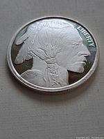Close-up image of the front side of the silver round displaying the Native American profile and LIBERTY inscription.