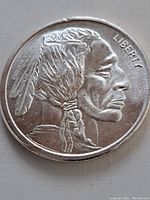 Obverse side of the silver round showing Native American profile and 'LIBERTY' inscription.