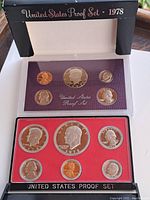 Open 1978 United States proof coin set showing both obverse and reverse coins in two trays with black outer box.