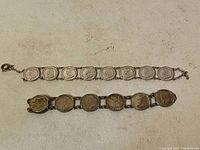 Two silver bracelets laid flat showing linked Canadian coins with Queen Elizabeth II portrait.