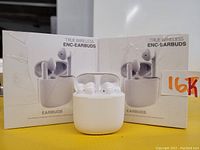 Two retail boxes of True Wireless ENC Earbuds in white color with one charging case opened displaying the earbuds inside