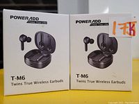 Two boxed PowerAdd T-M6 True Wireless Earbuds sets, showing packaging and product image, black earbuds with charging cases.