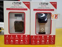 Front view of two iTime Elite smart watches in original box packaging, showing white and beige silicone bands and square watch faces.