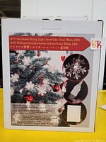 Box showing image and description of 19 foot Christmas snowflake clear white LED string lights with USB power