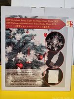 Photo of the product packaging showing the 19-foot Christmas string light with clear white snowflake LED lights and USB power connection.