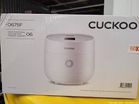 Front box of Cuckoo rice cooker showing image and model CR-0675F.