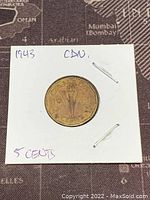 Obverse side of the coin with the torch design and denomination details.