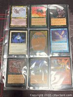 Top row and some middle row Magic: The Gathering cards in plastic sleeves showing variety of cards such as 'Mercenary Geologist' and others.
