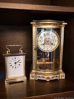 Front view of both clocks on shelf