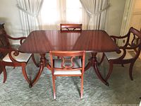 Overall view of dining table and six chairs without extension leaves