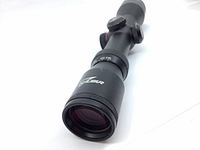 Close-up of lens and Excalibur branding showing scope condition and optics size.