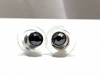 Close-up front view of the pair of black Swarovski crystal stud earrings in ruthenium plating showing faceted stones and clear plastic backing