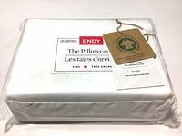 Packaged set of two king size ENDY pillowcases in alpine white with label and organic textile certification tags