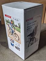 Box of Schwinn Deluxe Child Carrier with product images and brief description showing child seat mounted behind adult cyclist, suitable for ages 1+ and max weight 40 lbs.