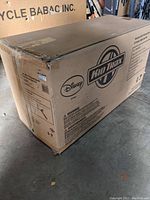 Box of Disney Kid Trax 4 wheeler showing brand logo and shipping details