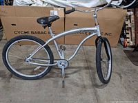 Side view of full Cadillac Eldorado bicycle showing aluminum frame, black seat, and tires.