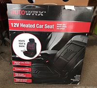 Front box image showing AutoWRX brand 12V heated car seat with claims of seat and back heating, ideal for multiple vehicle types, standard 12V plug, and dual heat settings.