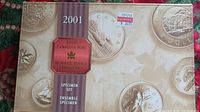 Original exterior box of the 2001 Royal Canadian Mint Specimen Set, beige with coin images and a label.