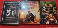 Photo of three DVD cases: American Gangster (2-disc unrated extended edition), The Last of the Mohicans, and The 13th Warrior.