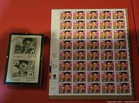 Full sheet of 40 USPS Elvis Presley 29 cent stamps alongside the framed Elvis poll postcard with choices A and B.