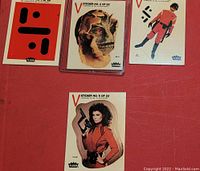 Close-up showing five stickers from Fleer V Series including numbered stickers 1,2,3,4,5 of 22