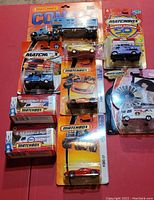 Overview of all 9 unopened Matchbox vehicles in original packaging showing various models and series.