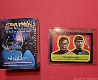Photo showing the factory sealed Star Trek Deep Space Nine trading cards box and the Star Trek Lives collectible card in sleeve beside it.