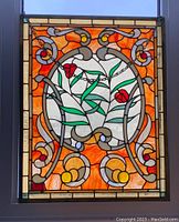 Full view of stained glass panel mounted in window