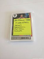Top view of Kessler Edwards basketball rookie card with note listing sports included: hockey, basketball, football, soccer, total 20 cards.