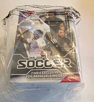 Front of sealed Topps Major League Soccer trading card box showing players and league branding
