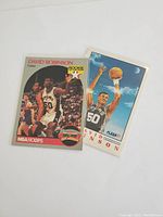 Front of two David Robinson rookie cards side by side displaying player images, rookie logos, and NBA Hoops branding.