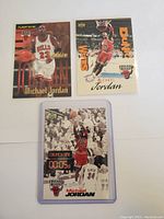 Three different Michael Jordan basketball cards laid out grouped.