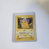 Front of the Base Set Pikachu Pokémon card showing artwork, name, HP, and attack details.