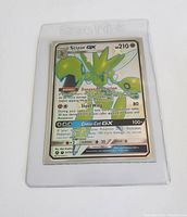 Front of Scizor GX Pokemon card showing full art, HP 210, abilities and attacks