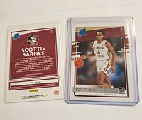 Front and back views of the Scottie Barnes rookie card from 2021 Donruss Draft Picks set with protective sleeve shown.