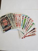 Spread of multiple soccer rookie cards featuring Frank Onyeka and others.