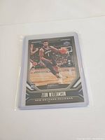 Front of Zion Williamson rookie card showing the player in action in a New Orleans Pelicans uniform.