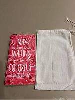 Planner Perfect Journal with rose-themed cover and text, next to plain muslin bag.