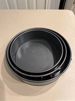 Three round springform pans nested inside each other