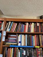 Two shelves of used books about English history, royalty, and medieval subjects.