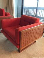 Front and right-side view of teak frame and red cushion