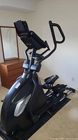 Front-left view of Sole E95s elliptical trainer showing full frame and pedals