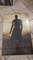 Front view of Gladiator movie poster showing packaging and label indicating plastic poster.