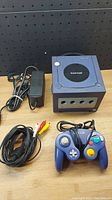 Front view showing console, controller, power adapter and AV cable