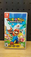 Front view of the Nintendo Switch game case with Mario + Rabbids Kingdom Battle cover art.