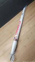 Full photo umbrella in packaging view showing branding and wrapping