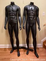 Front view of two slim black male mannequins with no heads and arms down, showing front muscular torso and legs.