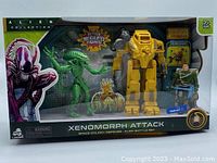 Front view of the Alien 40th Anniversary Collection Xenomorph Attack boxed set showing Power Loader, Colonial Marine figure, Warrior Alien figure, and alien egg accessory.