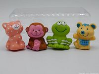Front view of all four vintage Strawberry Shortcake figures showing their colorful, detailed designs and facial expressions.