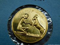 Close-up of front side of Capricorn zodiac coin showing detailed relief, dates DEC 23 to JAN 20, zodiac symbol, and inscription 'CAPRICORN'